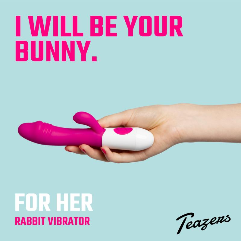Hand holding a pink and white rabbit vibrator with text on a light blue background Realistic Rabbit Vibrator - Pink